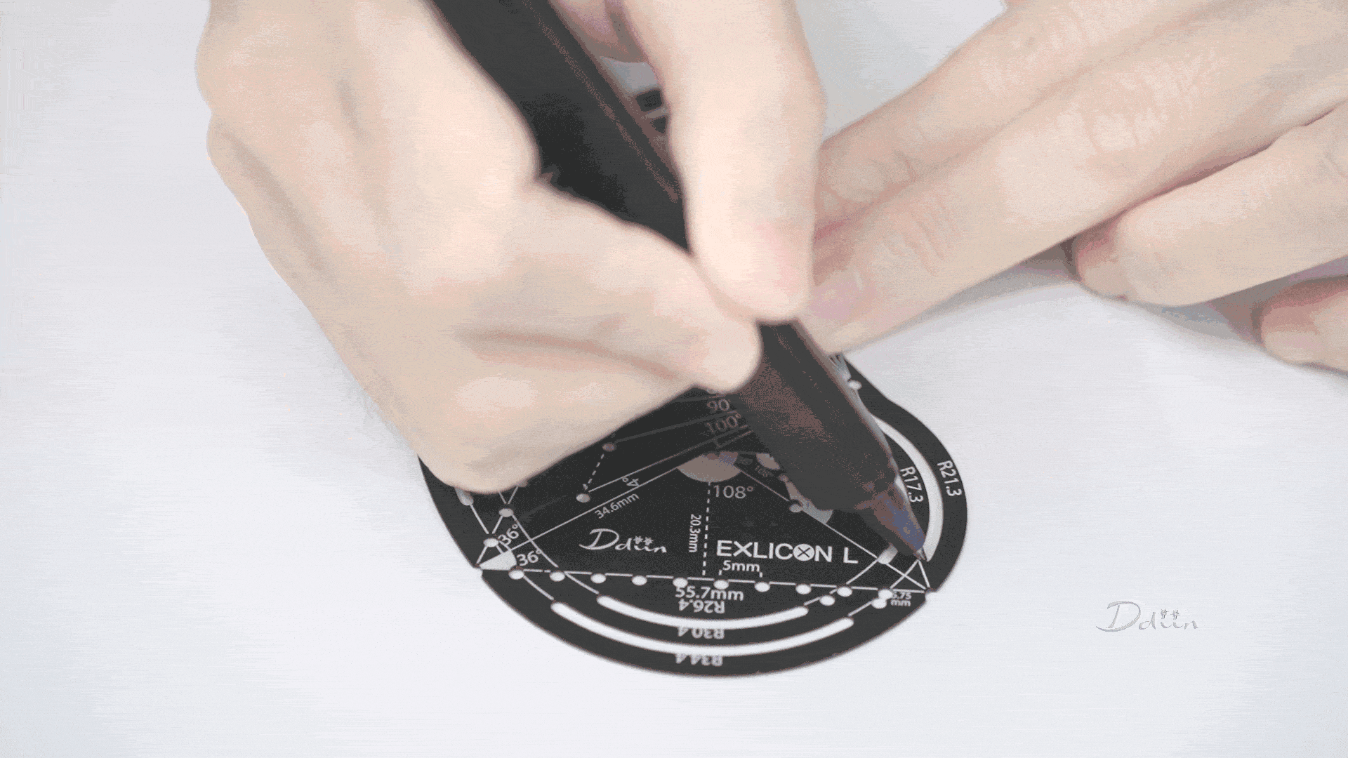 Demonstration of drawing golden ratio spirals with black geometric compass with measurement markings