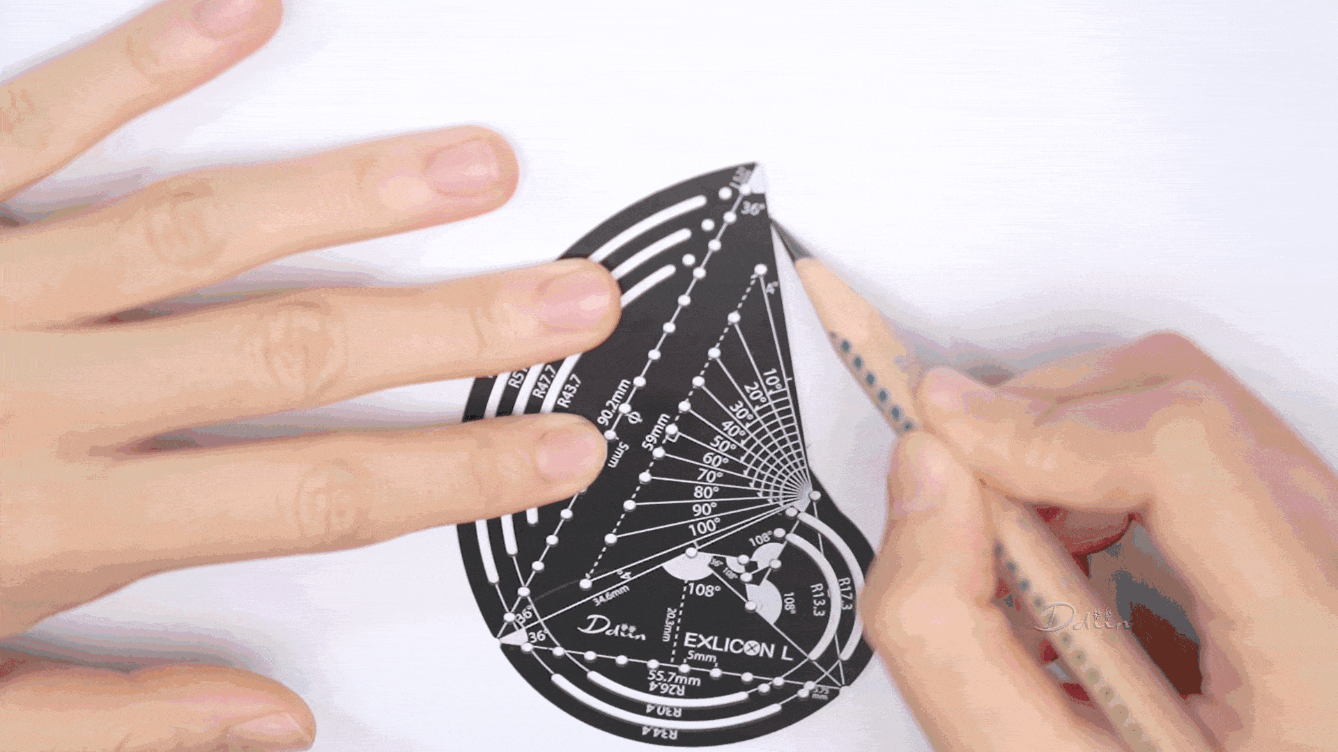 Demonstration of drawing different angles and geometries with black golden ratio compass with measurement markings