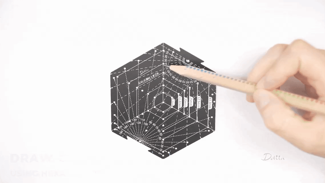 Demonstration of drawing complex patterns using black hexagon tool with measurement markings on white paper