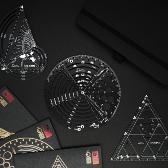 Collection of black geometric tools including a circular protractor, triangle compass, and golden ratio ruler on a black background