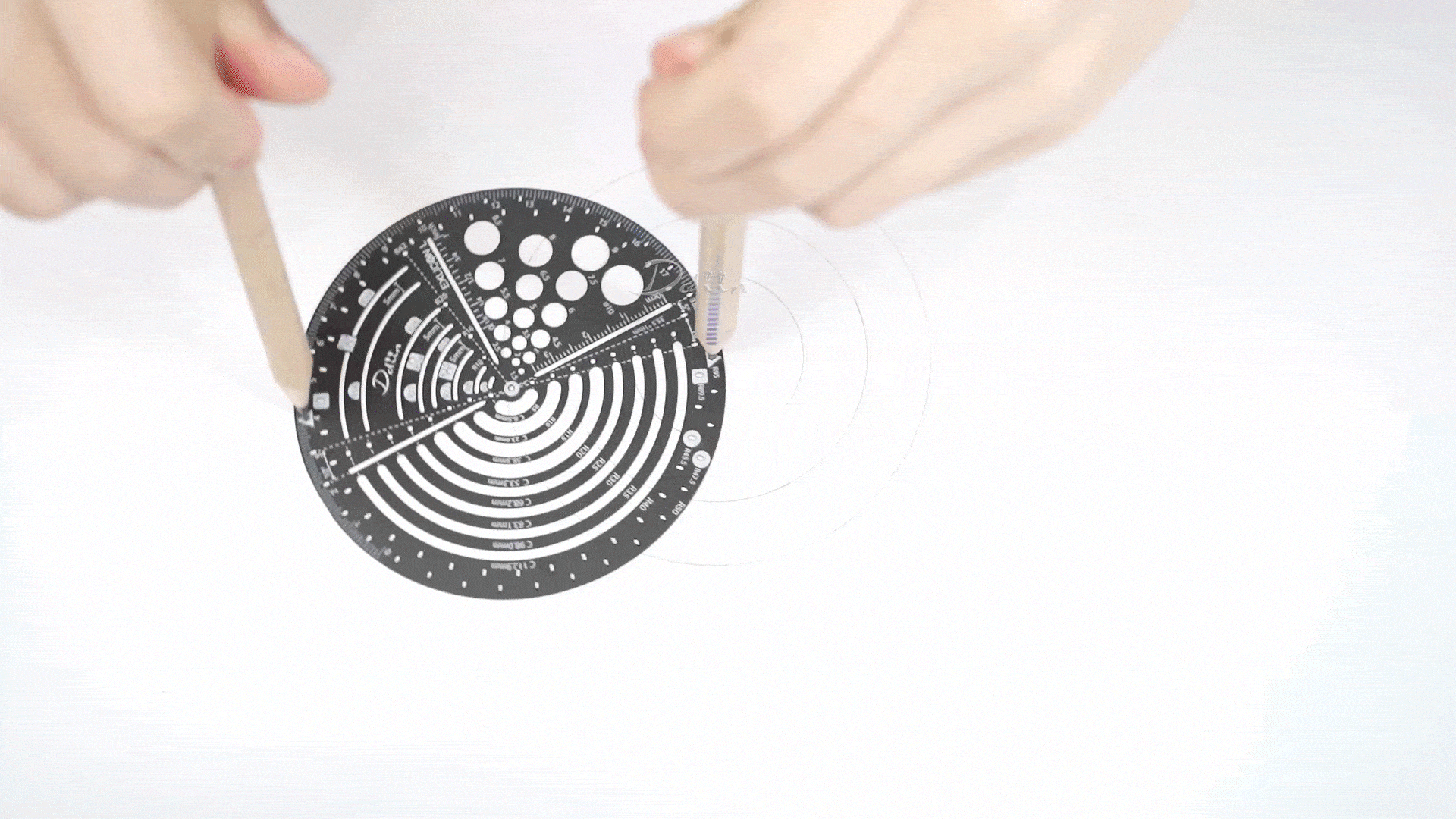 Demonstration on drawing different radius with black circular compass