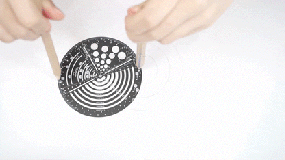 Demonstration on drawing different radius with black circular compass